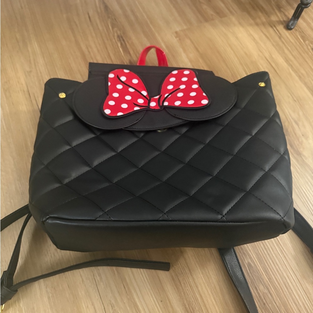 Disney Dani brand backpack. Black Quilted Backpack with Red Polka Dot Bow